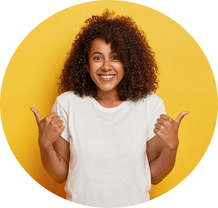 happy curly haired girl makes thumbs up sign demonstrates support and respect to someone smiles pleasantly achieves desirable goal wears white t shirt tn